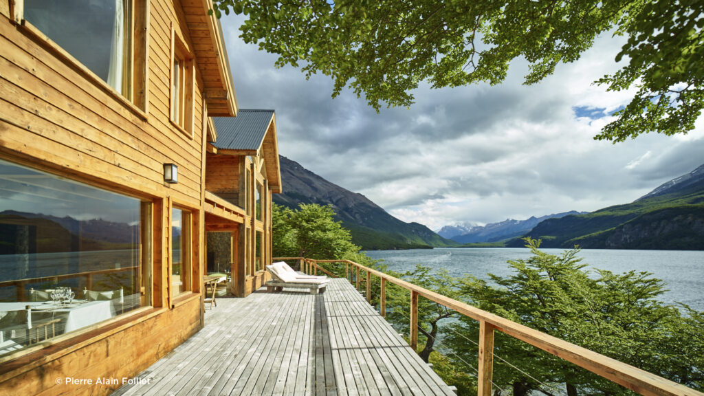 Aguas Arriba Lodge View Wooden deck of Aguas Arriba Lodge overlooking Lake del Desierto in Patagonia